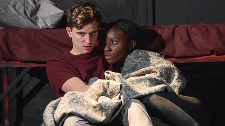 Billy Harris as Callum and Heather Agyepong as Sephy - Noughts and Crosses - Credit Robert Day