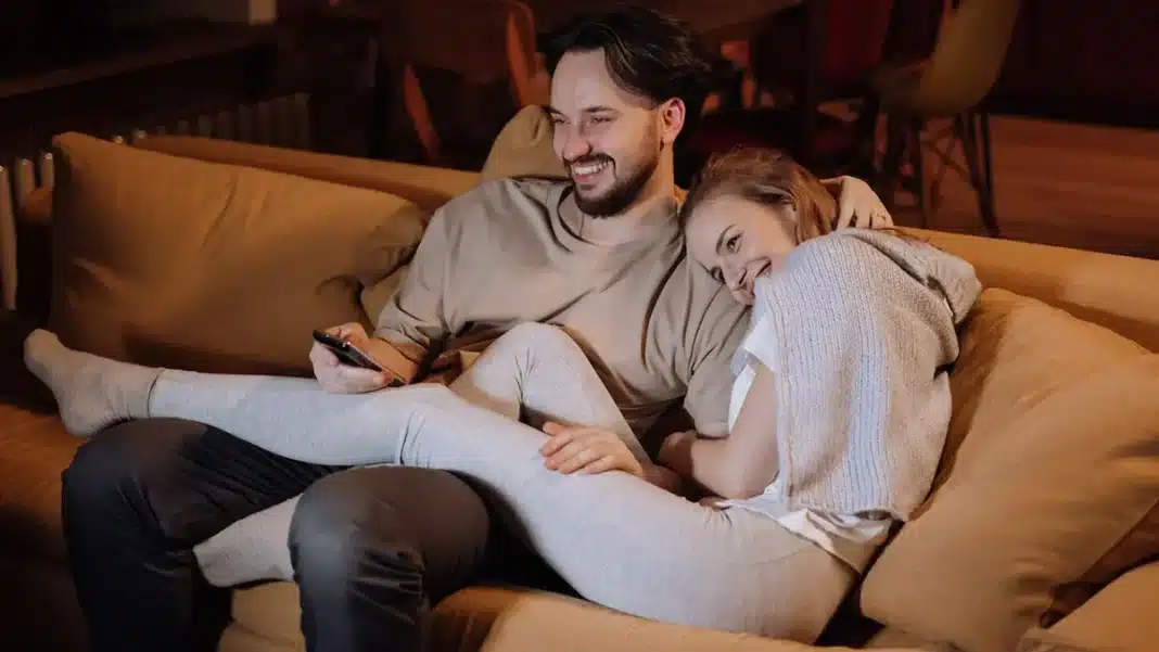 Young couple watching TV