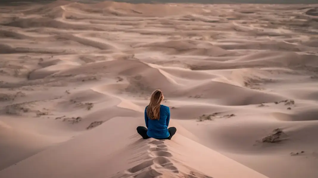 Woman sat on sand