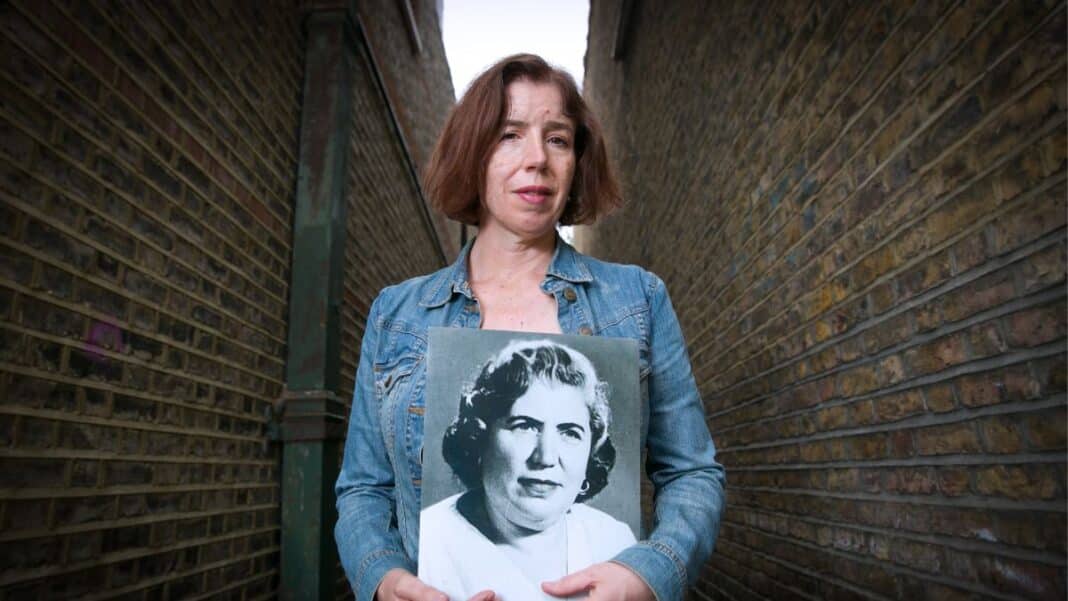 The Mother of Kamal by Dina Ibrahim - Dina is pictured holding a portrait of her grandmother