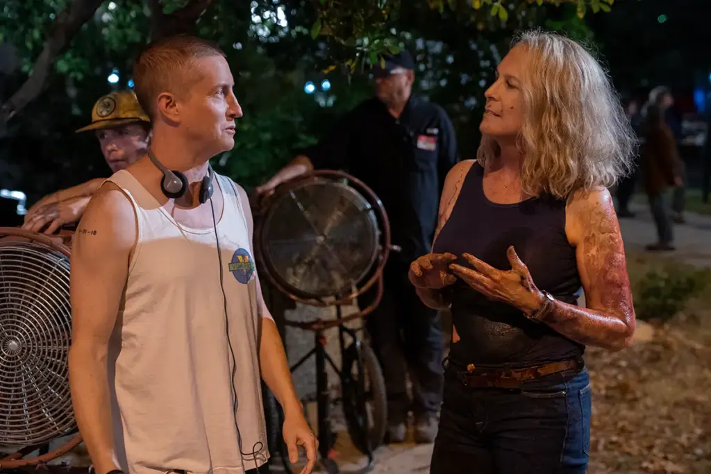 Green and Curtis confer outside Laurie’s house during the shooting of Halloween Kills. Originally, Green says, it was thought Curtis wouldn’t want to be involved, so Laurie was written as a cameo. But during the writing process, “We started getting excited about Laurie ideas. We were writing it unintentionally in Jamie Lee’s voice.” Green pitched Curtis the script before sending it to her. “She read it that night, and called me the next morning and said, ‘Let’s do it.’”