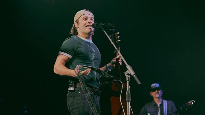 Max McNown performing at The O2 in London for C2C 2025