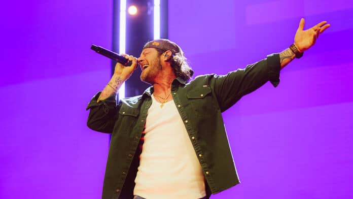 Tyler Hubbard performing at The O2 in London for C2C 2025